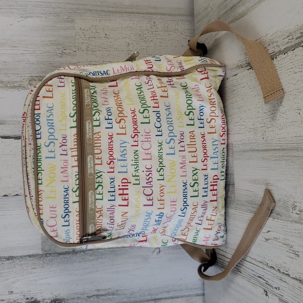 LeSportsac cream rainbow logo print backpack with tan straps